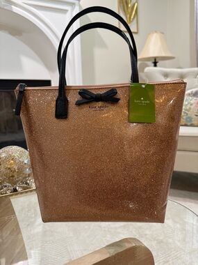 kate spade Rose Gold Glitter Tote with Black Handles and Bow  she’s a cutie